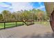 Enjoy outdoor living on this spacious deck overlooking a lush, expansive backyard and serene wooded area at 173 Chestnut Grove Rd, Statesville, NC 28625