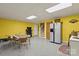 The spacious basement offers a retro kitchen with a dining area, laundry area, and tons of flex space at 173 Chestnut Grove Rd, Statesville, NC 28625