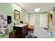 A bathroom with a sink, wooden vanity, a mirror, and a spooky theme at 173 Chestnut Grove Rd, Statesville, NC 28625