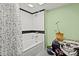 A bathroom with a tiled shower, white subway tile, and decorative accents at 173 Chestnut Grove Rd, Statesville, NC 28625