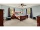 Comfortable bedroom with soft carpet, natural light and a ceiling fan at 173 Chestnut Grove Rd, Statesville, NC 28625