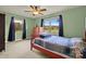 This is a bedroom with green walls, two windows, and a wooden bed frame at 173 Chestnut Grove Rd, Statesville, NC 28625