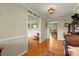 Open foyer view with hardwood floors leading to the dining room, showcasing classic trim and natural light at 173 Chestnut Grove Rd, Statesville, NC 28625