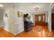 Inviting foyer with hardwood floors, classic decor, and a decorative wooden front door with sidelights at 173 Chestnut Grove Rd, Statesville, NC 28625