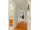 Hallway with wood floors leading to the bathroom and bedroom at 173 Chestnut Grove Rd, Statesville, NC 28625