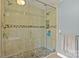 Walk-in shower with custom tile and glass door at 173 Chestnut Grove Rd, Statesville, NC 28625