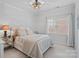 This bedroom has carpet, neutral walls, a window, and comfortable furniture at 18418 Turnberry Ct, Davidson, NC 28036
