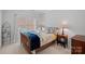 This cozy bedroom features a comfortable bed, a window, and neutral walls at 18418 Turnberry Ct, Davidson, NC 28036