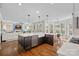 Open-concept kitchen with a large island, modern appliances, and seamless access to the living area at 18418 Turnberry Ct, Davidson, NC 28036