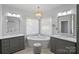 The main bathroom features dual vanities, soaking tub, and neutral wall color at 18418 Turnberry Ct, Davidson, NC 28036