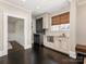Stylish bar area features custom cabinets, a stainless steel dishwasher, and an adjacent seating area at 2030 Radcliffe Ave, Charlotte, NC 28207