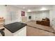 Finished basement featuring neutral carpet, a brown sofa, and decorative lighting at 2030 Radcliffe Ave, Charlotte, NC 28207