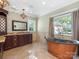 Bathroom featuring a standalone copper tub, chandelier, and ample natural light at 2030 Radcliffe Ave, Charlotte, NC 28207