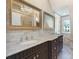Elegant bathroom featuring double sinks with marble countertops and large decorative mirrors at 2030 Radcliffe Ave, Charlotte, NC 28207