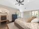 Charming bedroom with a brick fireplace, neutral walls, and dark wood floors at 2030 Radcliffe Ave, Charlotte, NC 28207