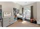 Cozy bedroom with daybed, decorative dresser, window seat, and natural light at 2030 Radcliffe Ave, Charlotte, NC 28207