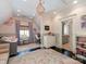 Inviting bedroom featuring stylish decor, a cozy crib, and a doorway leading to the bathroom at 2030 Radcliffe Ave, Charlotte, NC 28207