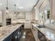 Spacious kitchen featuring a large island, custom cabinetry, and stainless steel appliances at 2030 Radcliffe Ave, Charlotte, NC 28207