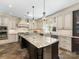 Spacious kitchen with custom cabinets, granite countertops, and modern stainless steel appliances at 2030 Radcliffe Ave, Charlotte, NC 28207