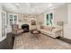 Cozy living room with coffered ceiling, fireplace, built-in shelving, and neutral tones at 2030 Radcliffe Ave, Charlotte, NC 28207