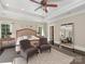 Spacious main bedroom with tray ceilings and sitting area, enhanced by natural light and generous closet space at 2030 Radcliffe Ave, Charlotte, NC 28207