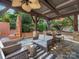 Outdoor patio area with a seating, an outdoor fireplace, and beautiful landscaping at 2030 Radcliffe Ave, Charlotte, NC 28207