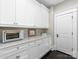 Pantry with custom cabinets, ample counter space, and convenient access to the kitchen at 2030 Radcliffe Ave, Charlotte, NC 28207