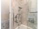 Luxurious shower and tub combination with marble tile at 2030 Radcliffe Ave, Charlotte, NC 28207
