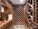 Custom wine cellar with wooden shelving and a stone floor, perfect for wine enthusiasts at 2030 Radcliffe Ave, Charlotte, NC 28207