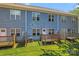 Townhome backyard with small decks and green grass at 2032 Summey Ave, Charlotte, NC 28205