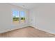 Bedroom featuring wood-look floors and a window at 2032 Summey Ave, Charlotte, NC 28205