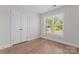 Bright bedroom featuring a window with a view and a closet at 2032 Summey Ave, Charlotte, NC 28205