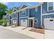 Attractive townhome complex in blue and white with a one-car garage at 2032 Summey Ave, Charlotte, NC 28205