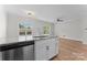 Bright, open kitchen featuring granite countertops, stainless steel appliances, and ample natural light at 2032 Summey Ave, Charlotte, NC 28205