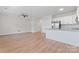 Open-concept living space featuring hardwood floors and stainless-steel appliances in the kitchen at 2032 Summey Ave, Charlotte, NC 28205