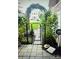 Home featuring a decorative black metal gate leading to a peaceful backyard at 216 Harrison Ln # 4, Locust, NC 28097