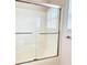 Clean bathroom with sliding glass shower door and natural light from the window at 216 Harrison Ln # 4, Locust, NC 28097