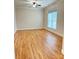 This bedroom features a ceiling fan, large window and wood floors, perfect for relaxation at 216 Harrison Ln # 4, Locust, NC 28097
