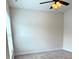 Comfortable bedroom with carpeted floors, ceiling fan, and a large window for natural light at 216 Harrison Ln # 4, Locust, NC 28097