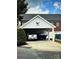 Charming carport featuring an American Eagle, providing shelter for vehicles and boasting patriotic decor at 216 Harrison Ln # 4, Locust, NC 28097