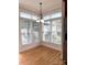 Bright dining area with wood floors and lots of windows at 216 Harrison Ln # 4, Locust, NC 28097