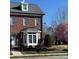 Beautiful brick home with manicured lawn, American flag, and elegant bay window at 216 Harrison Ln # 4, Locust, NC 28097