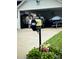 A well-maintained home featuring a decorative mailbox and colorful flower bed, enhancing its curb appeal at 216 Harrison Ln # 4, Locust, NC 28097