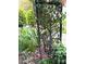 Beautiful garden area featuring climbing roses and verdant foliage at 216 Harrison Ln # 4, Locust, NC 28097