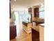 Bright kitchen with granite counters, stainless appliances, wood floors, and center island at 216 Harrison Ln # 4, Locust, NC 28097