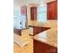 Bright kitchen with granite counters, stainless appliances, wood floors, and center island at 216 Harrison Ln # 4, Locust, NC 28097