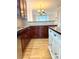Cherry cabinets and stainless appliances in this open concept kitchen with wood floors at 216 Harrison Ln # 4, Locust, NC 28097