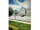 View of the Locust Public Library, offering community resources and architectural charm in a serene setting at 216 Harrison Ln # 4, Locust, NC 28097