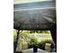 This property includes a covered patio with fan and lights, table, and seating at 216 Harrison Ln # 4, Locust, NC 28097