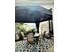 This home includes a covered outdoor patio featuring a light fixture, rug and table and chairs at 216 Harrison Ln # 4, Locust, NC 28097